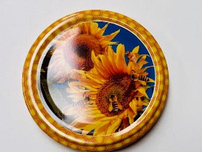 honey jar lids decorated with pictures of beautiful bees and bee inspire designs for australian honey and australian beekeeping for sale