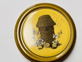 honey jar lids decorated with pictures of beautiful bees and bee inspire designs for australian honey and australian beekeeping for sale