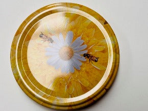 honey jar lids decorated with pictures of beautiful bees and bee inspire designs for australian honey and australian beekeeping for sale