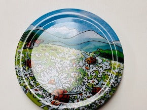 honey jar lids decorated with pictures of beautiful bees and bee inspire designs for australian honey and australian beekeeping for sale