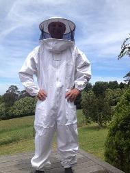 picture of a man wearing beekeeper suit